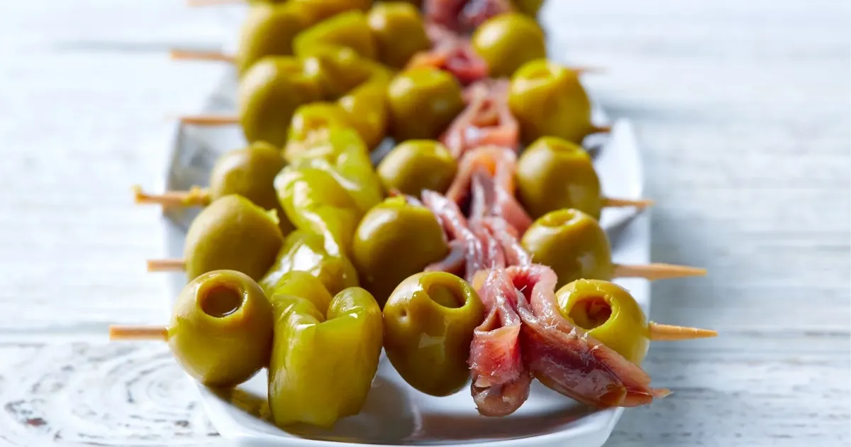 Pintxos and small drinks on a bar counter in San Sebastián