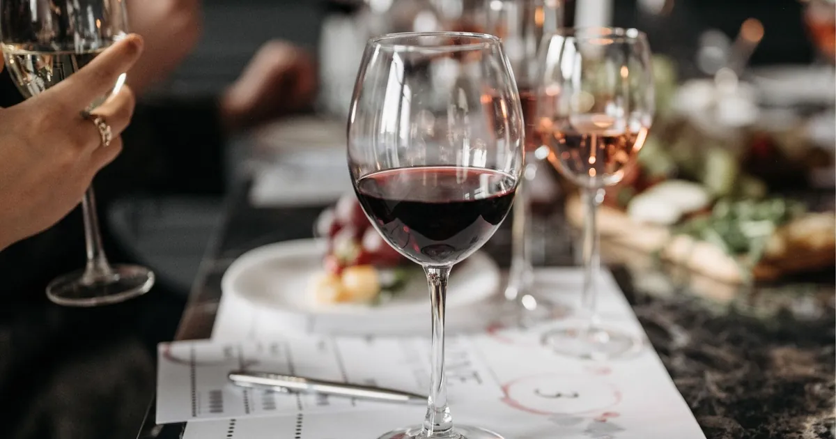 Glasses of red and rosé wine on a tasting table
